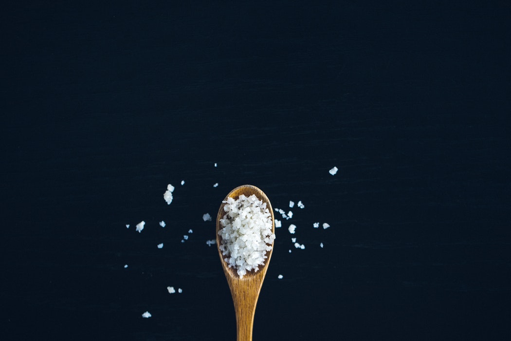 Brown spoon filled with coarse salt- Image for blog Who who Carpet cleaning