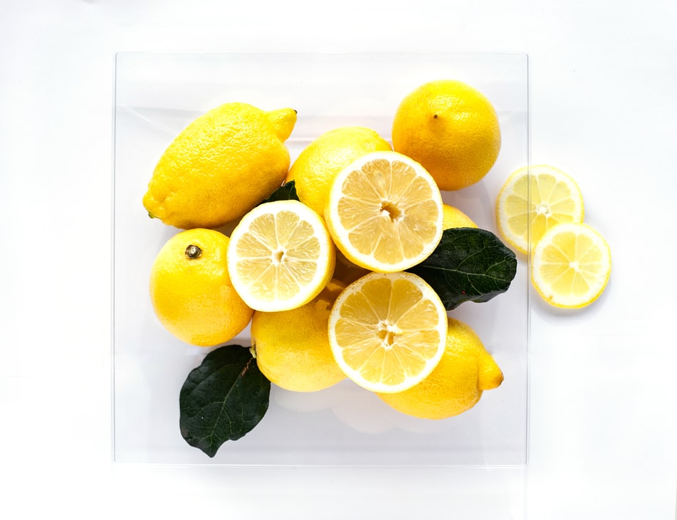 Cut and Full Lemons on the table